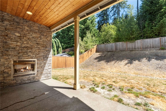 exterior space with an outdoor stone fireplace