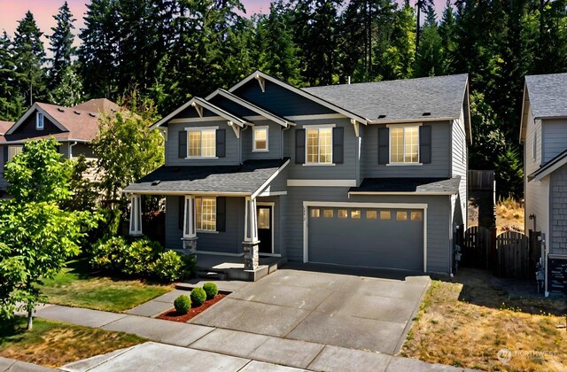 craftsman inspired home with a garage