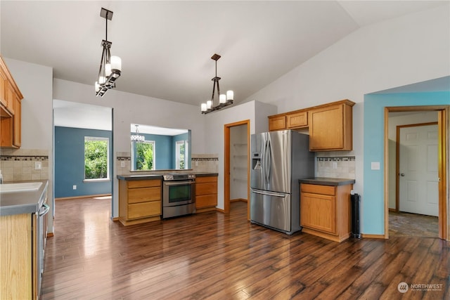 kitchen with appliances with stainless steel finishes, tasteful backsplash, decorative light fixtures, dark hardwood / wood-style flooring, and lofted ceiling