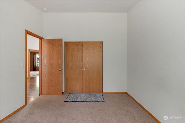 empty room featuring light carpet