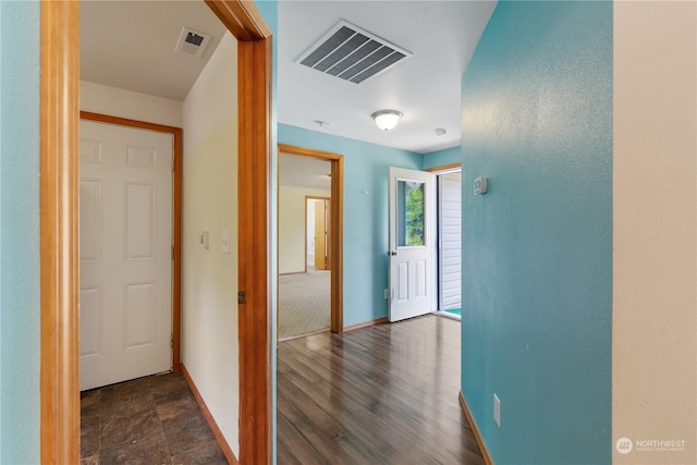 hallway featuring dark hardwood / wood-style floors