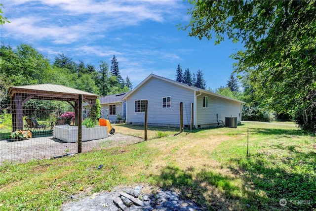 view of home's exterior with a patio area, a gazebo, a lawn, and cooling unit