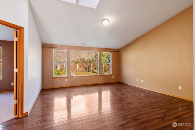 unfurnished living room featuring lofted ceiling and dark wood-type flooring