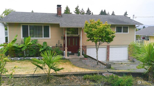 view of front of property with a garage