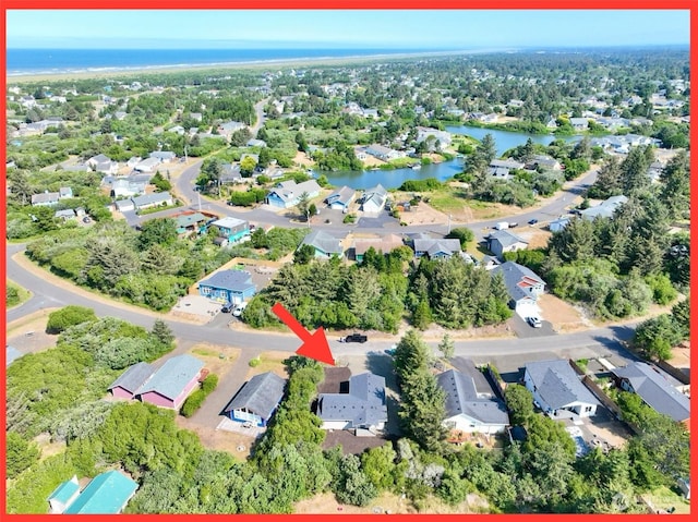 bird's eye view with a water view and a residential view