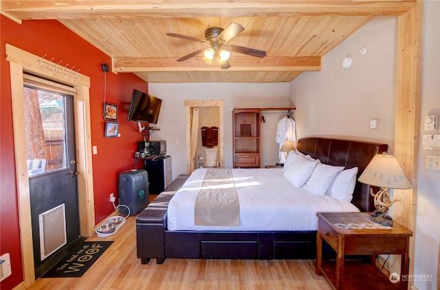 bedroom featuring beam ceiling, wood-type flooring, wood ceiling, and ceiling fan