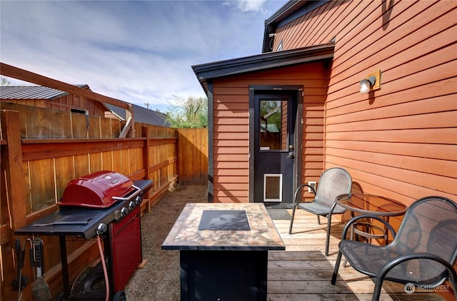 deck featuring an outdoor fire pit