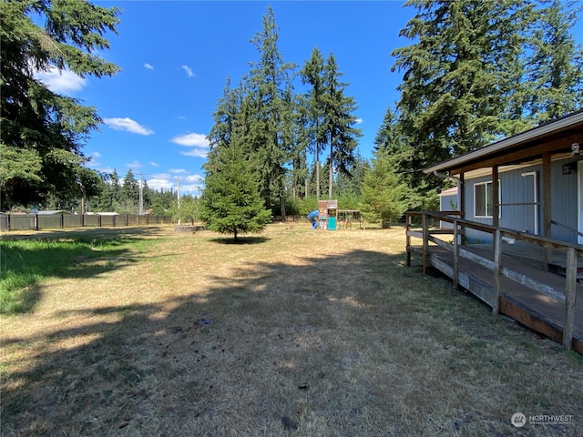 view of yard with a deck