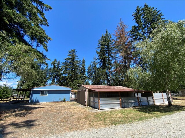 exterior space featuring an outbuilding