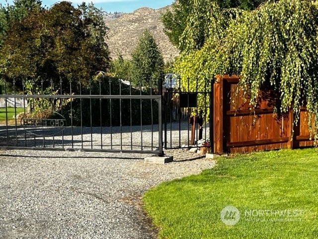 view of gate with a mountain view