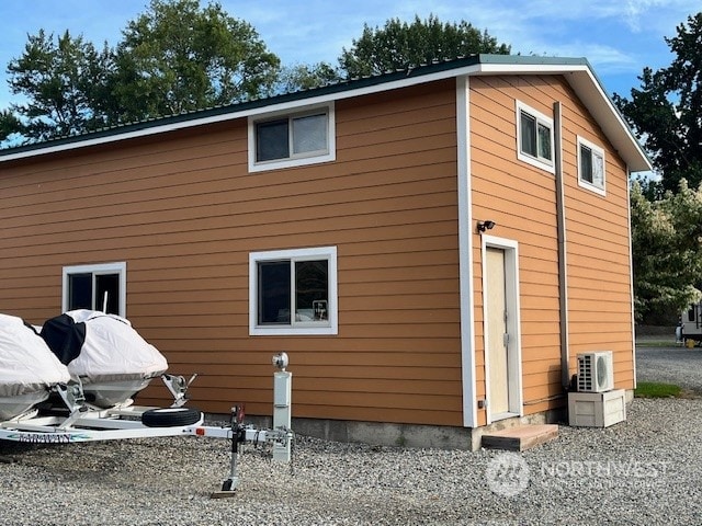 view of home's exterior with ac unit