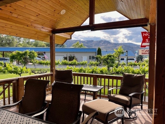 wooden deck featuring a mountain view