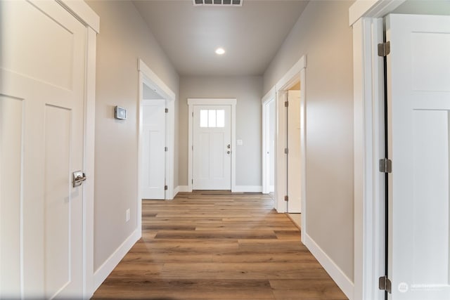 hallway featuring wood-type flooring