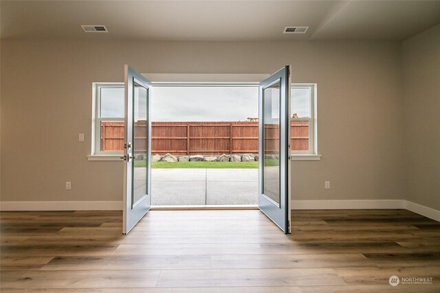 entryway with hardwood / wood-style floors