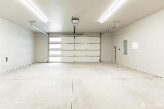 garage with electric panel and a garage door opener