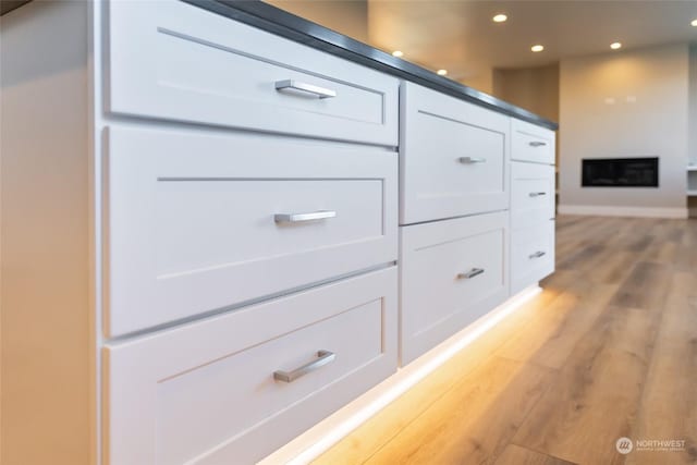 interior details with hardwood / wood-style flooring