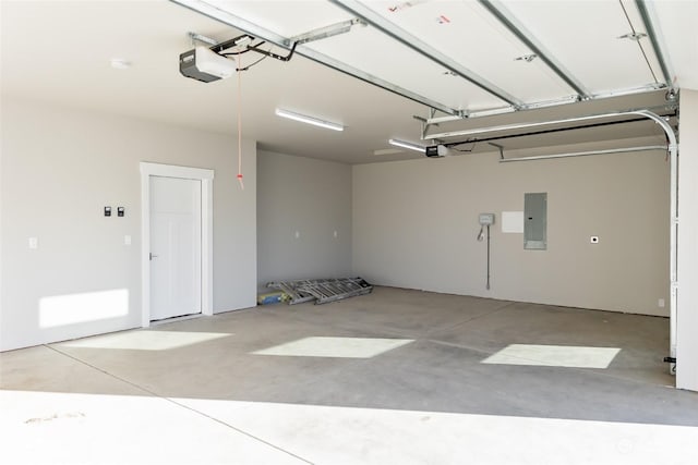 garage with electric panel and a garage door opener