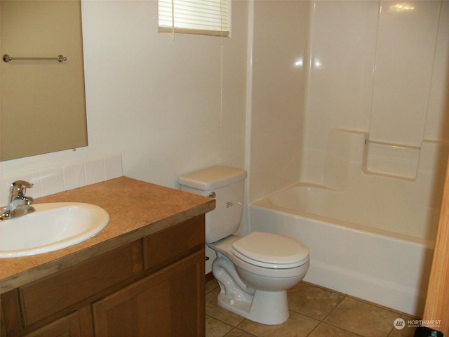 1715 W Bemis St, Moses Lake, WA 98837 - bathroom with toilet, vanity, and tile patterned floors