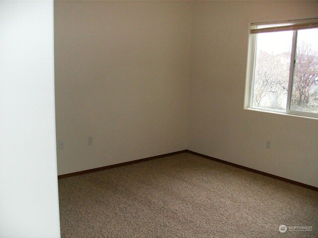 1715 W Bemis St, Moses Lake, WA 98837 - empty room with carpet floors and baseboards