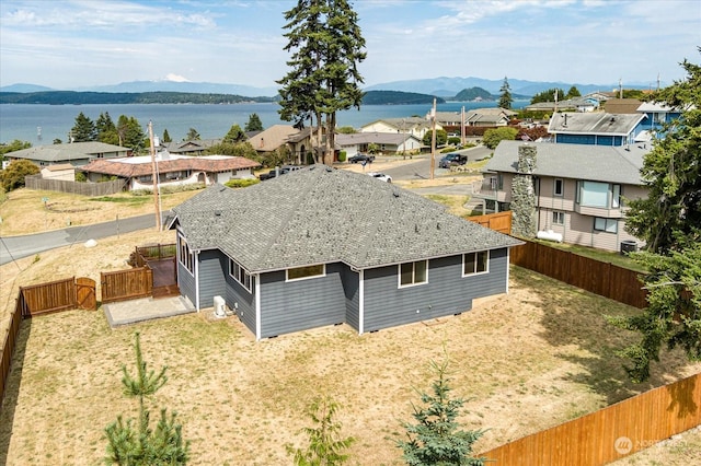 bird's eye view with a residential view and a water and mountain view