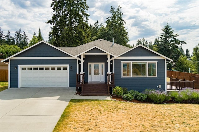 view of front facade with a garage and a front yard