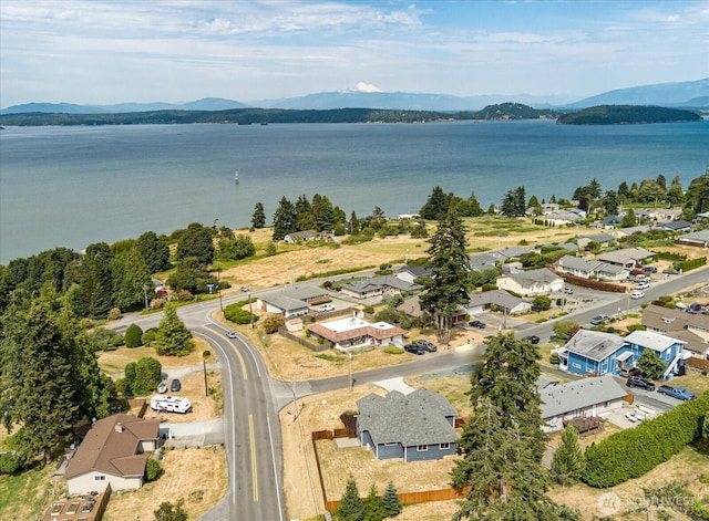 bird's eye view with a residential view and a water and mountain view