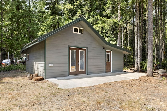 rear view of house with french doors and a patio area