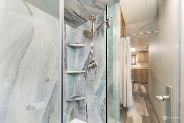 bathroom with vanity, a shower with curtain, and hardwood / wood-style flooring