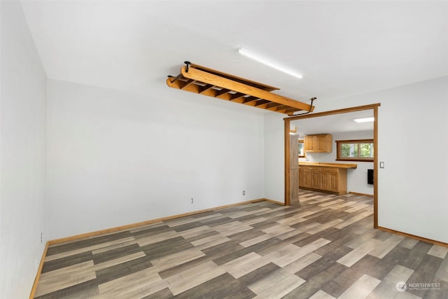 unfurnished living room with light wood-type flooring