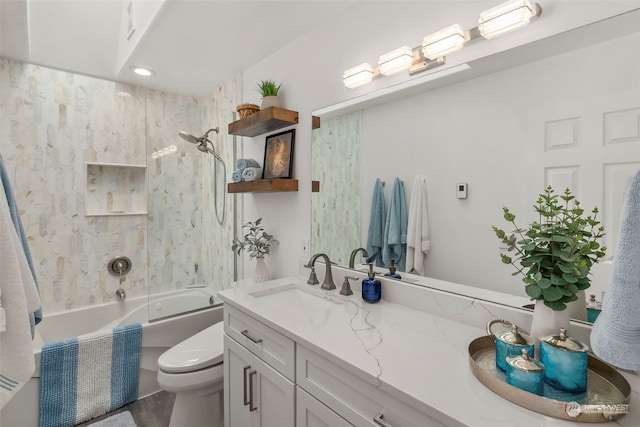 full bathroom with tiled shower / bath combo, vanity, and toilet