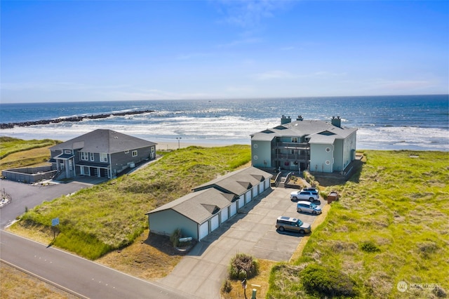 drone / aerial view with a water view and a view of the beach