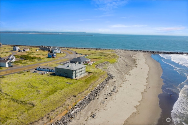 aerial view featuring a view of the beach and a water view