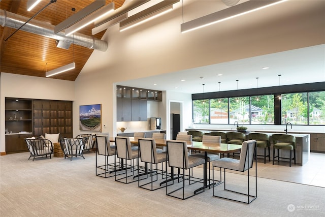 2524 Acer Loop SE, Lacey, WA 98513 - dining area featuring wood ceiling, a high ceiling, and light carpet