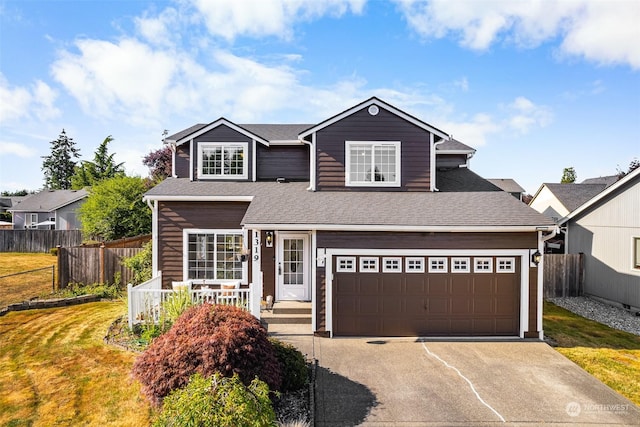 view of front of house featuring a garage and a front yard