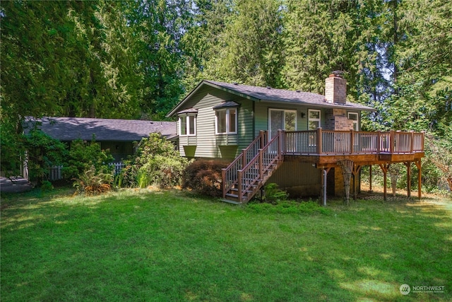 back of house featuring a yard and a deck