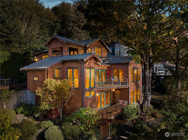 back of house with a balcony