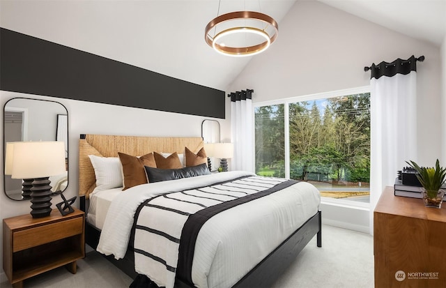 carpeted bedroom with lofted ceiling and multiple windows