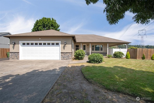 view of front of house with a garage and a front lawn