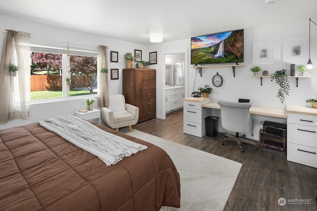 bedroom with dark hardwood / wood-style flooring and ensuite bath