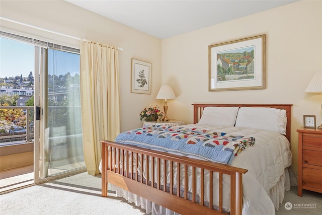 carpeted bedroom featuring access to outside