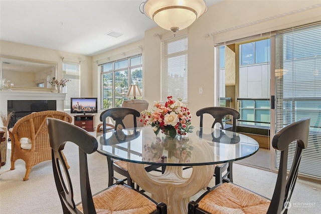 dining space featuring carpet flooring