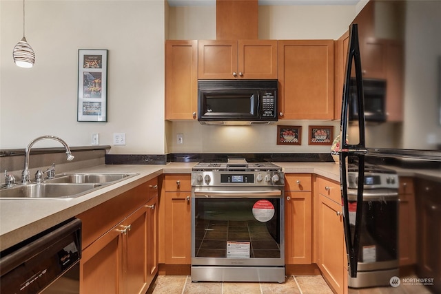 kitchen with pendant lighting, sink, and black appliances