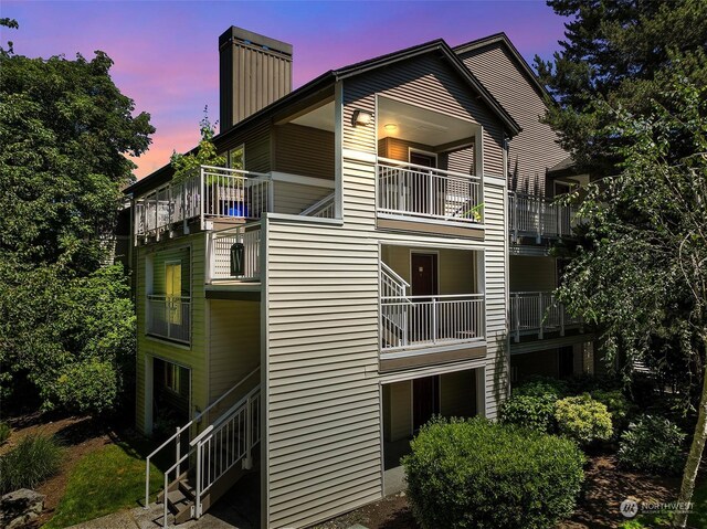 view of outdoor building at dusk