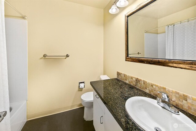 full bathroom featuring vanity, tasteful backsplash, toilet, and shower / bath combination with curtain