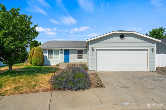 ranch-style house featuring a garage, fence, a front lawn, and concrete driveway