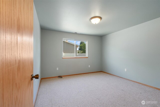 view of carpeted spare room