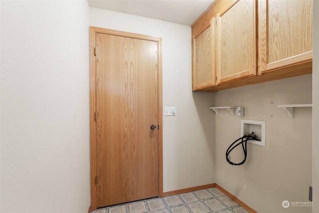 clothes washing area featuring light tile patterned flooring, cabinets, and hookup for a washing machine