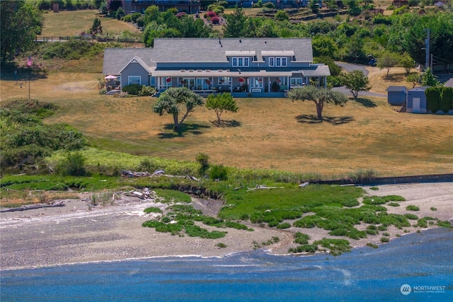 drone / aerial view with a water view