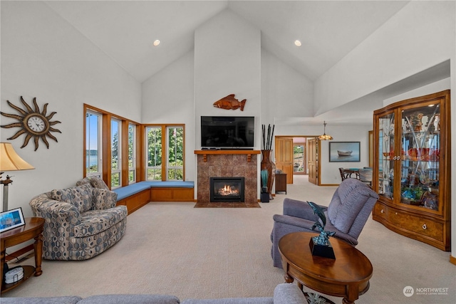 living room with carpet flooring and high vaulted ceiling