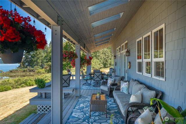 deck featuring outdoor lounge area